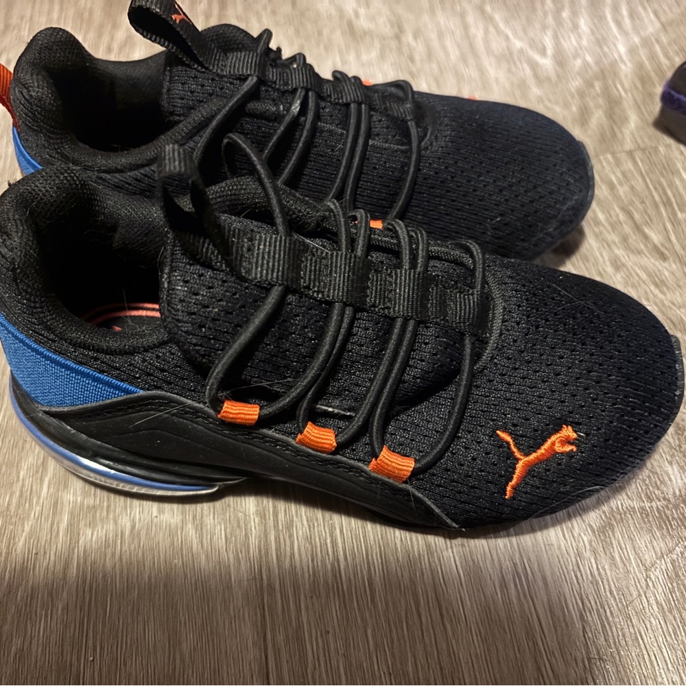 Puma Kids Black and Blue Athletic Sneakers with Orange Accents